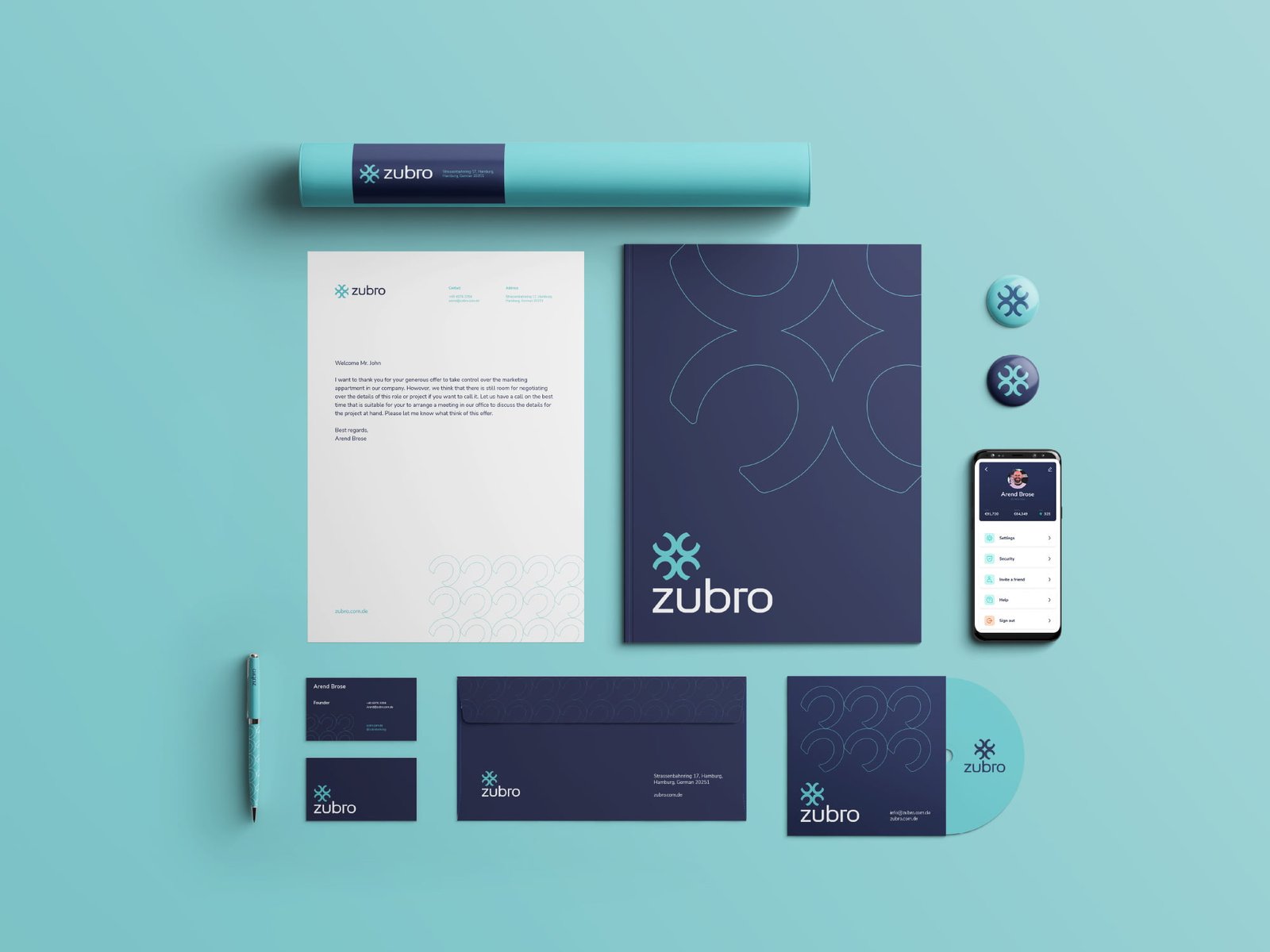 stationery design that includes letterhead, business card, envelope, pins, and cd.