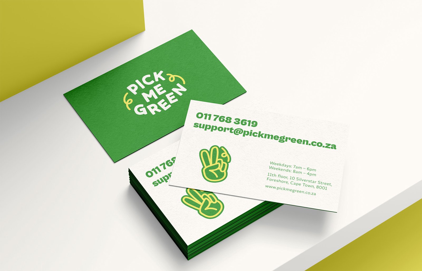 Fun and playful business card design with a hand illustration and big type in the back